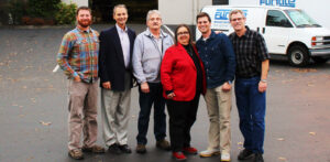 The Flintile Inc staff in a group photo in front of the office